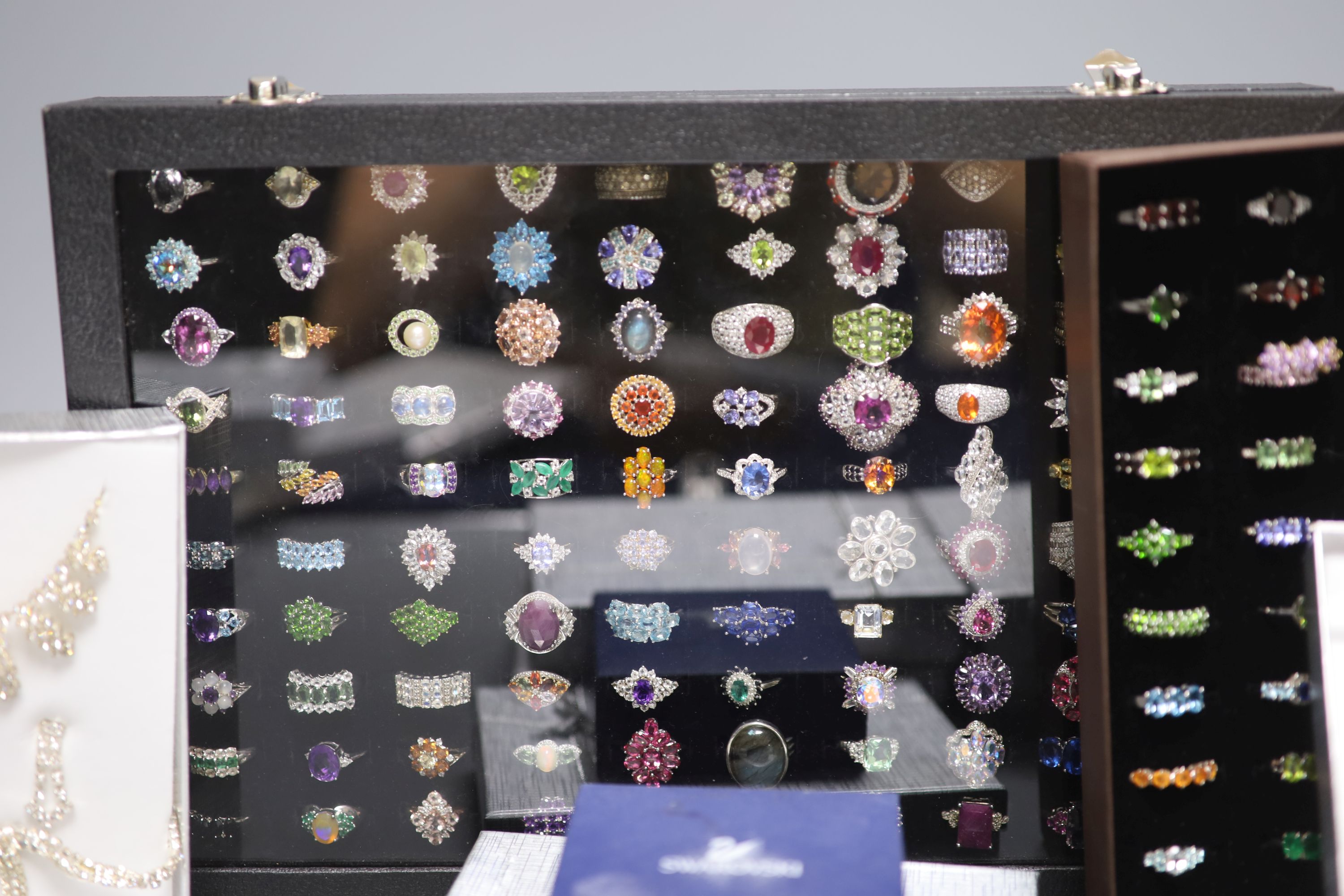 A large quantity of Swarovski costume jewellery and one hundred and thirty mainly 925 rings.